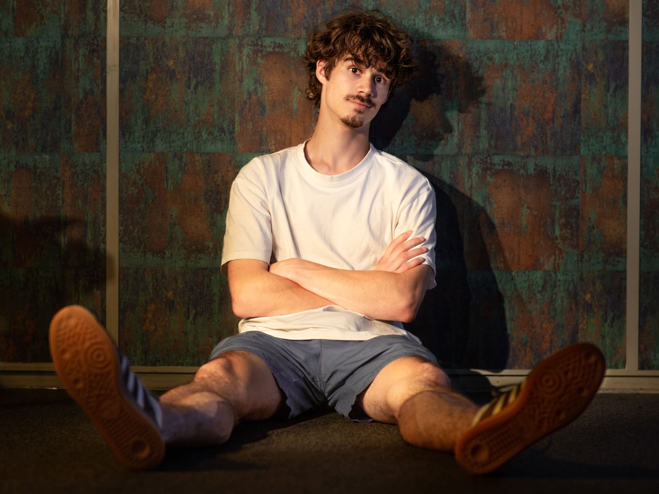 picture of yours truly sitting on the floor real goofy